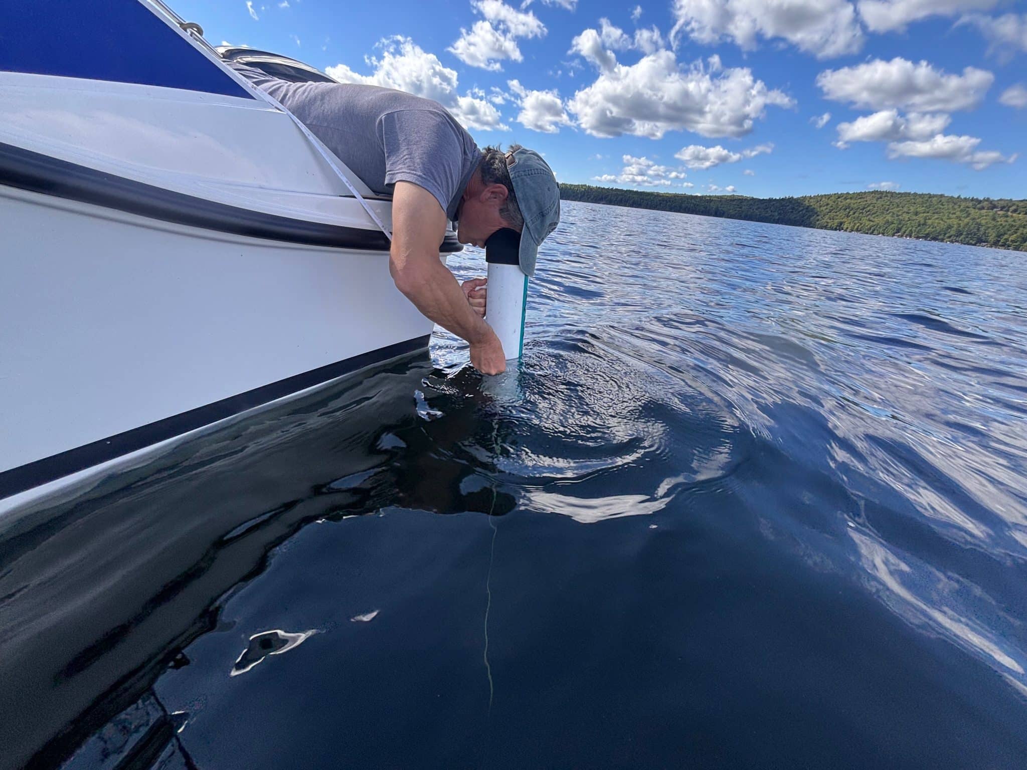 Paul Cain taking a Seechi Disk reading near the deepest part of Thompson Lake